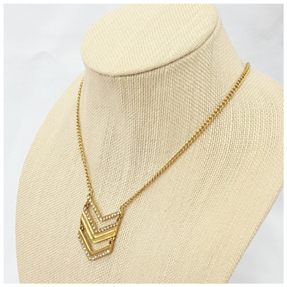 Rhinestone extra long goldtone hinged abstract.